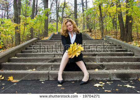 stock-photo-middle-age-woman-in-depression-on-an-autumn-nature-19704271.jpg