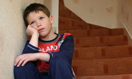 Unhappy-boy-sitting-on-st-009.jpg